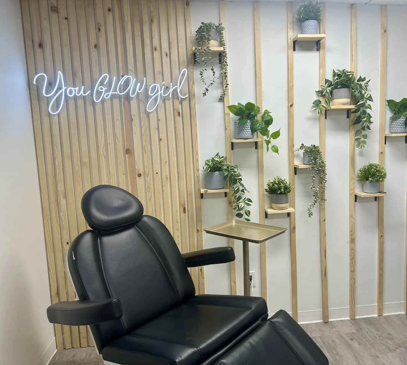 Treatment chair and plant wall in the Glow Med Spa Camas studio