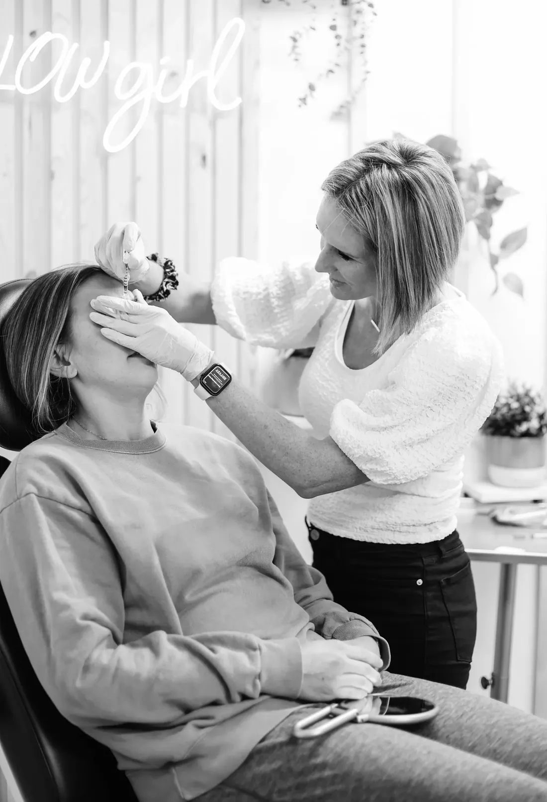 A Glow Med Spa nurse practitioner treating a client