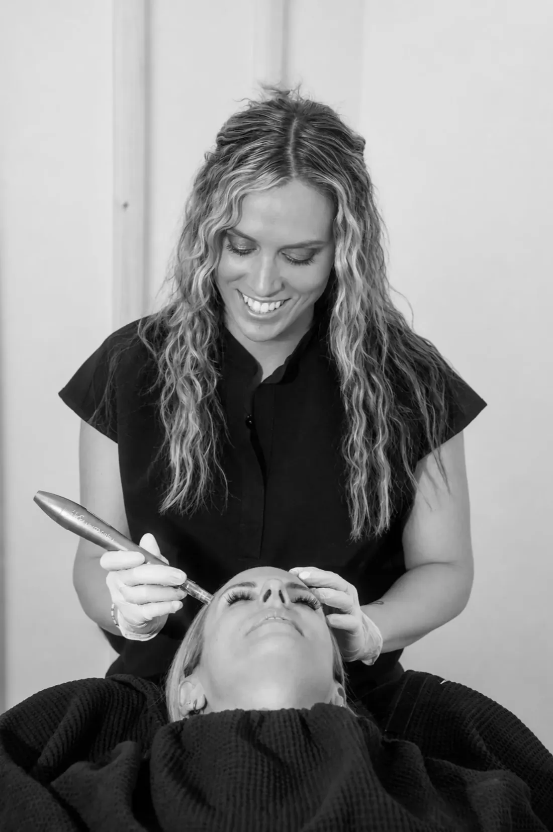 A Glow Med Spa provider performing PRF microneedling
